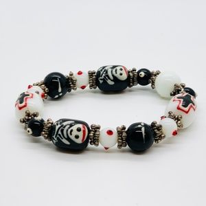 Peruvian Glass Bead Skull Cross Bracelet